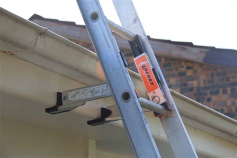 metal roof ladder brackets|ladder brackets for roof edge.